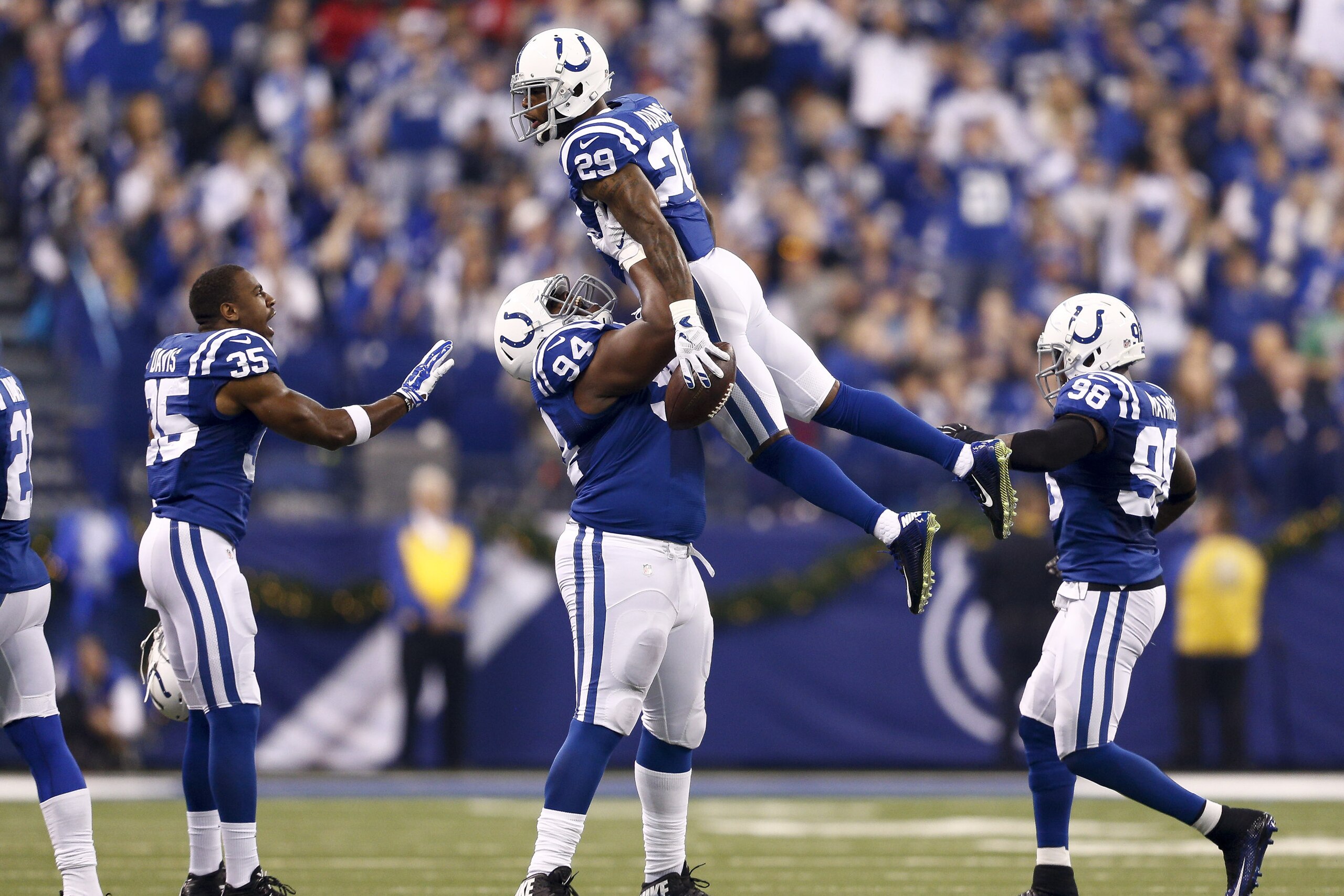 INDIANAPOLIS, IN - DECEMBER 20:  Zach Kerr #94 of the Indianapolis Colts holds up Mike Adams #29 after recovering a fumble during the first quarter against the Houston Texans at Lucas Oil Stadium on December 20, 2015 in Indianapolis, Indiana.  (Photo by Michael Hickey/Getty Images)