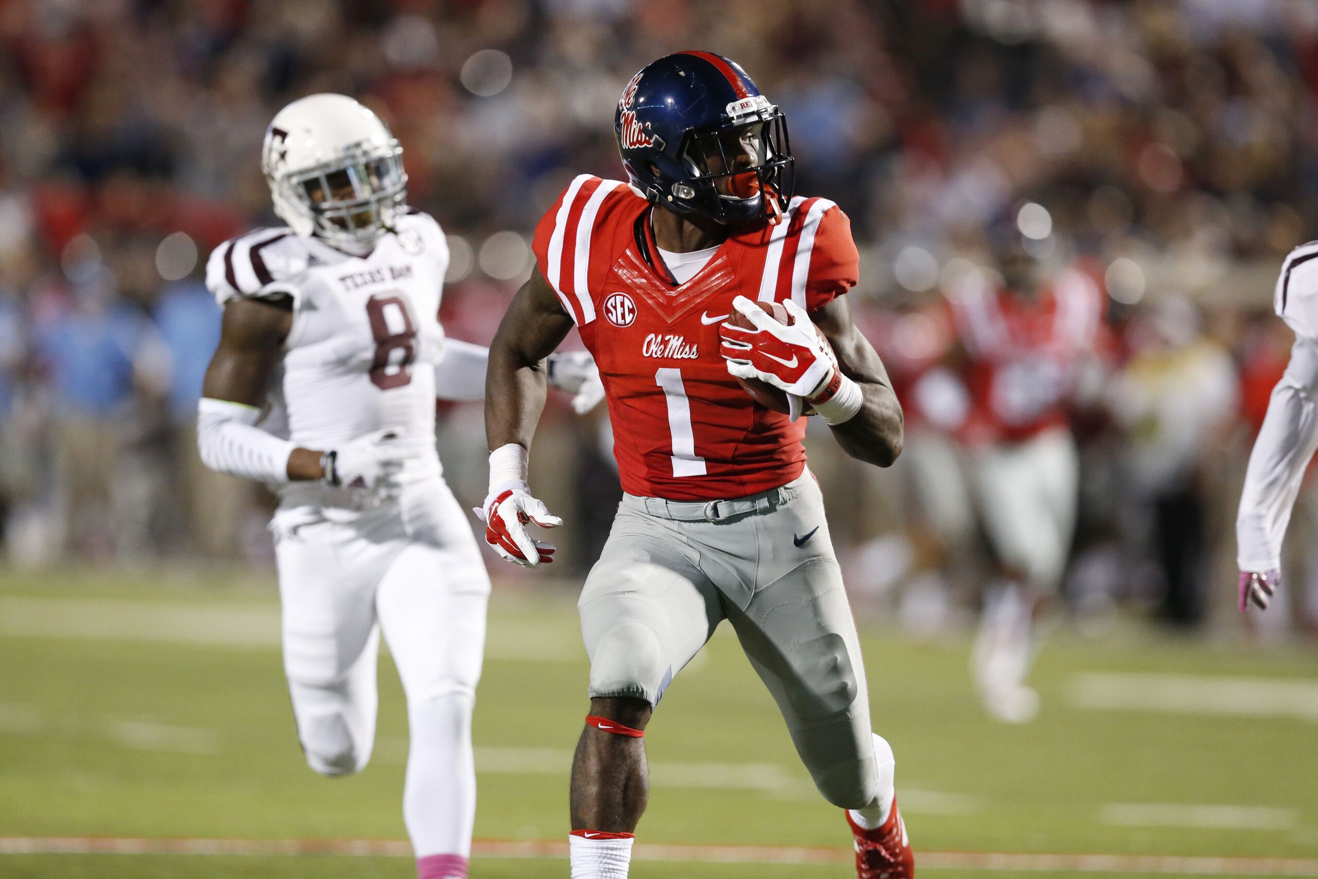 Mississippi wide receiver Laquon Treadwell (1) sprints away from Texas A&M defensive back Nick Harvey (8) for a 58 yard touchdown pass reception during the second half of their NCAA college football game in Oxford, Miss., Saturday, Oct. 24, 2015. No. 24 Mississippi won 23-3. (AP Photo/Rogelio V. Solis)