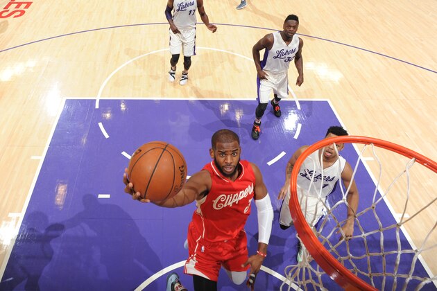 LOS ANGELES,CA - DECEMBER 25:  Chris Paul #3 of the Los Angeles Clippers goes up for the layup against the Los Angeles Lakers on December 25, 2015 at the Staples Center in Los Angeles, California.NOTE TO USER: User expressly acknowledges and agrees that, by downloading and or using this Photograph, user is consenting to the terms and conditions of the Getty Images License Agreement. Mandatory Copyright Notice: Copyright 2015 NBAE (Photo by Andrew D. Bernstein/NBAE via Getty Images)