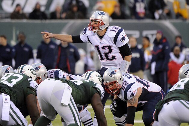 New England Patriots quarterback Tom Brady (12) points out the defense during the second half of an NFL football game against the New York Jets Sunday, Dec. 21, 2014, in East Rutherford, N.J. (AP Photo/Bill Kostroun)