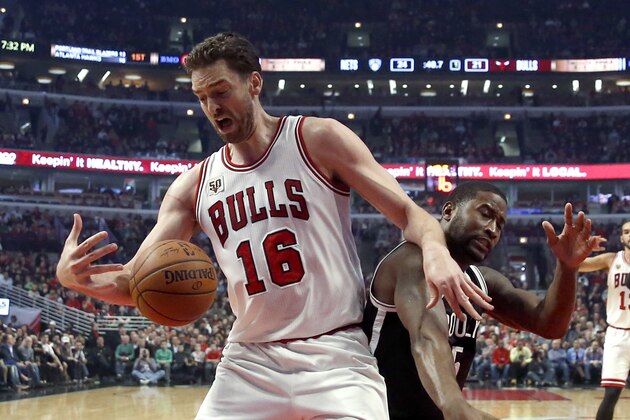 Chicago Bulls center Pau Gasol (16) screens out Brooklyn Nets guard Donald Sloan for a rebound during the first half of an NBA basketball game Monday, Dec. 21, 2015, in Chicago. (AP Photo/Charles Rex Arbogast)