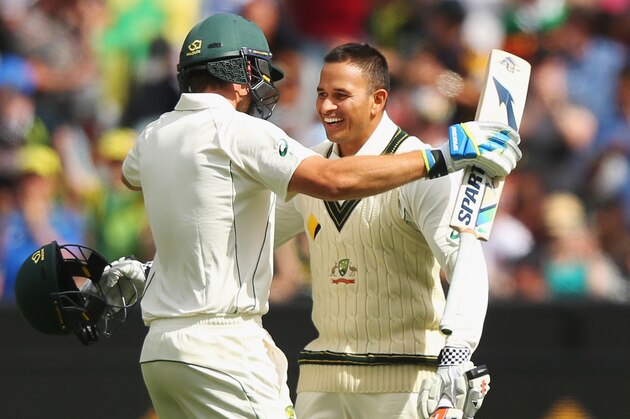 MELBOURNE, AUSTRALIA - DECEMBER 26:  Usman Khawaja of Australia celebrates his century with Joe Burns (L)  during day one of the Second Test match between Australia and the West Indies at Melbourne Cricket Ground on December 26, 2015 in Melbourne, Australia.  (Photo by Michael Dodge/Getty Images)