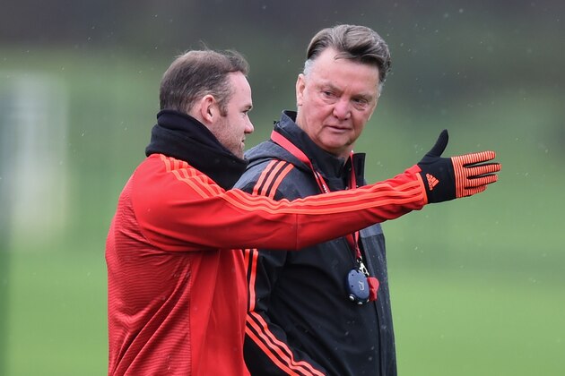 MANCHESTER, ENGLAND - NOVEMBER 24:  Wayne Rooney (L) and Louis van Gaal manager of Manchester United in discussion during the Manchester United training session on the eve of the UEFA Champions League Group B match against PSV Eindhoven at Aon Training Complex on November 24, 2015 in Manchester, England.  (Photo by Michael Regan/Getty Images)