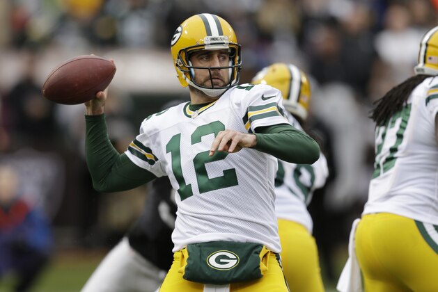 Green Bay Packers quarterback Aaron Rodgers (12) in action against the Oakland Raiders during an NFL football game Sunday, Dec. 20, 2015, in Oakland, Calif. (AP Photo/Ben Margot)