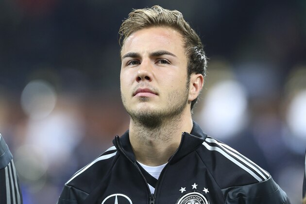 Germany midfielder Mario Gotze stands prior to the start of a friendly soccer match between Italy and Germany at the San Siro  stadium in Milan, Italy, Friday, Nov. 15, 2013. (AP Photo/Antonio Calanni)