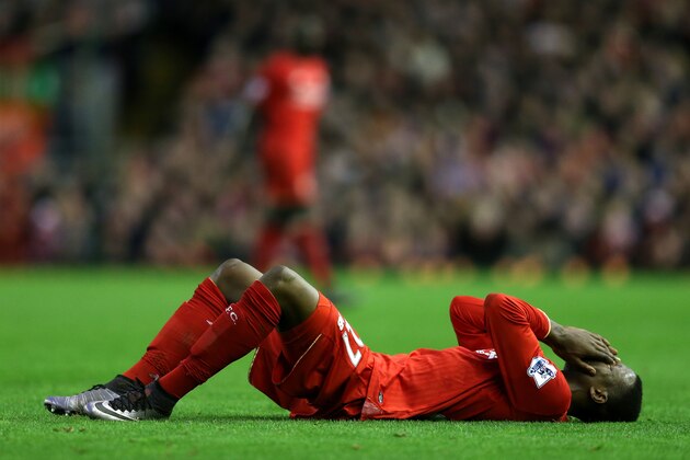 LIVERPOOL, ENGLAND - DECEMBER 26:  Divock Origi of Liverpool lies injured during the Barclays Premier League match between Liverpool and Leicester City at Anfield on December 26, 2015 in Liverpool, England.  (Photo by Chris Brunskill/Getty Images)