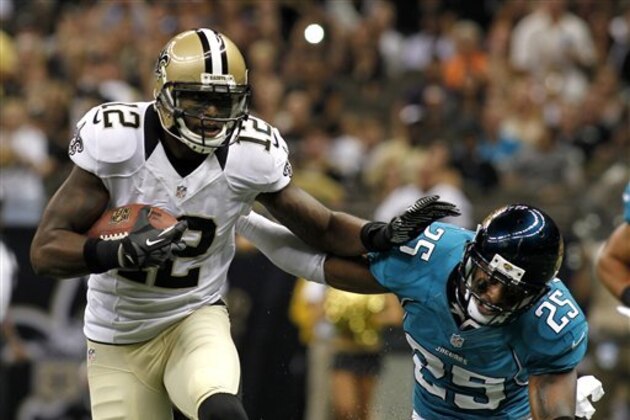 New Orleans Saints wide receiver Marques Colston (12) rushes past Jacksonville Jaguars defensive back William Middleton (29) in the first half of a preseason NFL football game in New Orleans, Friday, Aug. 17, 2012. (AP Photo/Jonathan Bachman)