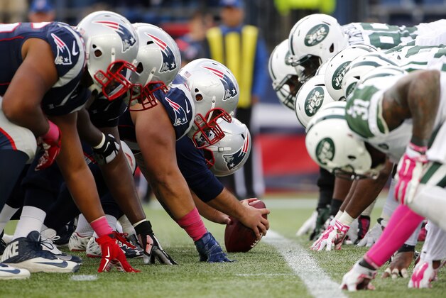 The New England Patriots and the New York Jets at the line of scrimmage for a snap during a NFL football game at Gillette Stadium in Foxborough, Mass. Sunday, Oct. 25, 2015. (Winslow Townson/AP Images for Panini)
