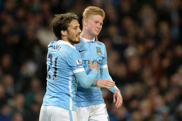 Manchester City's Belgian midfielder Kevin De Bruyne (R) celebrates with Manchester City's Spanish midfielder David Silva after scoring their fourth goal during the English Premier League football match between Manchester City and Sunderland at The Etihad stadium in Manchester, north west England on December 26, 2015. AFP PHOTO / OLI SCARFF

RESTRICTED TO EDITORIAL USE. No use with unauthorized audio, video, data, fixture lists, club/league logos or 'live' services. Online in-match use limited to 75 images, no video emulation. No use in betting, games or single club/league/player publications. / AFP / OLI SCARFF        (Photo credit should read OLI SCARFF/AFP/Getty Images)