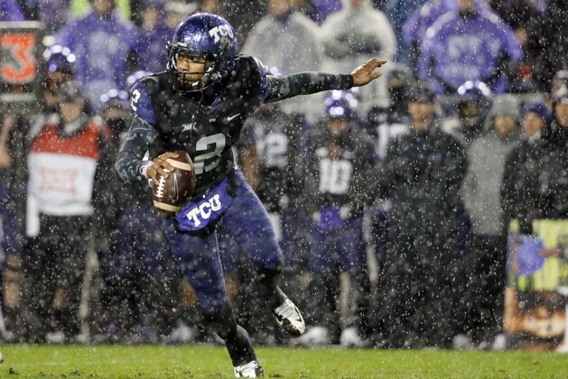 TCU quarterback Trevone Boykin scrambles out of the pocket in the first half of an NCAA college football game against Baylor, Friday, Nov. 27, 2015, in Fort Worth, Texas. (AP Photo/Tony Gutierrez)