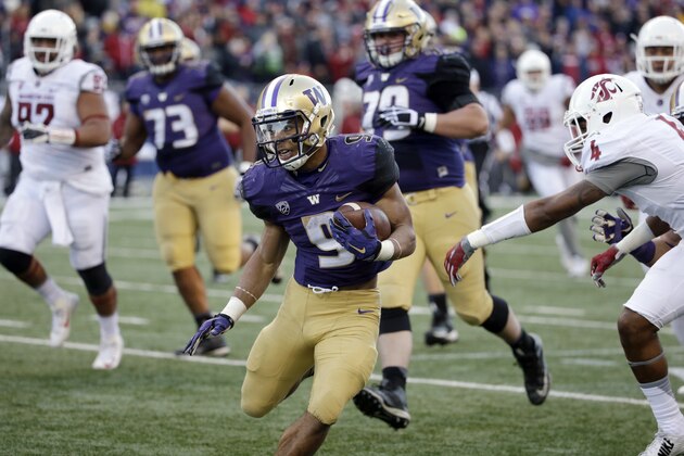 Washington's Myles Gaskin in action against Washington State in an NCAA college football game Friday, Nov. 27, 2015, in Seattle. (AP Photo/Elaine Thompson)