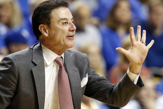 Louisville head coach Rick Pitino calls a play during the second half of an NCAA college basketball game against Kentucky Saturday, Dec. 26, 2015, in Lexington, Ky. Kentucky won 75-73. (AP Photo/James Crisp)