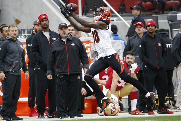 Cincinnati Bengals wide receiver A.J. Green (18) catches a pass against the San Francisco 49ers during the first half of an NFL football game in Santa Clara, Calif., Sunday, Dec. 20, 2015. (AP Photo/Tony Avelar)