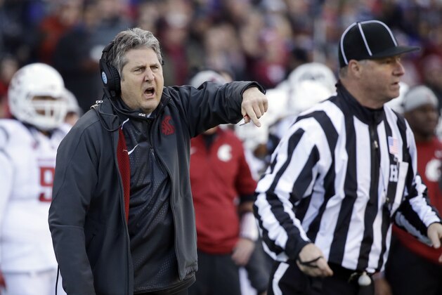 Washington State head coach Mike Leach yells toward the field in the first half of an NCAA college football game against Washington Friday, Nov. 27, 2015, in Seattle. (AP Photo/Elaine Thompson)