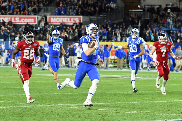 Dec 26, 2015; Bronx, NY, USA; Duke Blue Devils quarterback Thomas Sirk (1) runs with the ball on his way to the end-zone for a touchdown against the Indiana Hoosiers during the second quarter in the 2015 New Era Pinstripe Bowl at Yankee Stadium.  Mandatory Credit: Rich Barnes-USA TODAY Sports