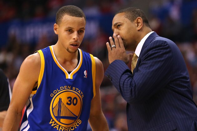 LOS ANGELES, CA - OCTOBER 31:  Head coach Mark Jackson and Stephen Curry #30 of the Golden State Warriors confer in the game with the Los Angeles Clippers at Staples Center on October 31, 2013 in Los Angeles, California. The Clippers won 126-115.  NOTE TO USER: User expressly acknowledges and agrees that, by downloading and or using this photograph, User is consenting to the terms and conditions of the Getty Images License Agreement.  (Photo by Stephen Dunn/Getty Images)