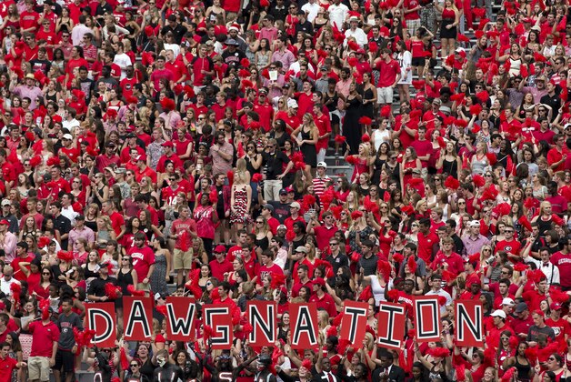 Georgia  fans cheer on the Bulldogs in the second half of an NCAA college football game against Tennessee  Saturday, Sept. 27, 2014, in Athens, Ga. Georgia won 35-32. (AP Photo/John Bazemore)