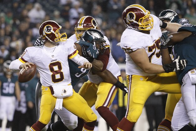 Washington Redskins' Kirk Cousins is sacked by Philadelphia Eagles' Fletcher Cox in the second half of an NFL football game, Saturday, Dec. 26, 2015, in Philadelphia.  (AP Photo/Matt Rourke)