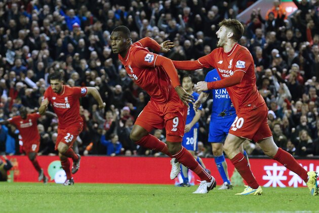Liverpool's Zaire-born Belgian striker Christian Benteke (2nd L) celebrates with teammates after scoring the opening goal of during the English Premier League football match between Liverpool and Leicester City at the Anfield stadium in Liverpool, north-west England on December 26, 2015.  AFP PHOTO / LINDSEY PARNABY

RESTRICTED TO EDITORIAL USE. No use with unauthorized audio, video, data, fixture lists, club/league logos or 'live' services. Online in-match use limited to 75 images, no video emulation. No use in betting, games or single club/league/player publications. / AFP / LINDSEY PARNABY        (Photo credit should read LINDSEY PARNABY/AFP/Getty Images)