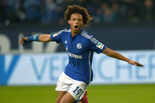 Schalke's midfielder Leroy Sane celebrates scoring during the German first division Bundesliga football match FC Schalke 04 v Eintracht Frankfurt in Gelsenkirchen, on September 23, 2015.    AFP PHOTO / PATRIK STOLLARZ  RESTRICTIONS: DURING MATCH TIME: DFL RULES TO LIMIT THE ONLINE USAGE TO 15 PICTURES PER MATCH AND FORBID IMAGE SEQUENCES TO SIMULATE VIDEO.  ==RESTRICTED TO EDITORIAL USE == FOR FURTHER QUERIES PLEASE  CONTACT THE  DFL DIRECTLY AT + 49 69 650050.        (Photo credit should read PATRIK STOLLARZ/AFP/Getty Images)