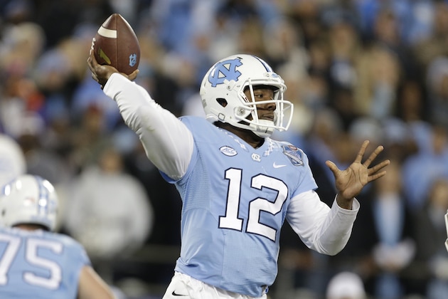 North Carolina quarterback Marquise Williams (12) passes during the first half of the Atlantic Coast Conference championship NCAA college football game against Clemson in Charlotte, N.C., Saturday, Dec. 5, 2015. (AP Photo/Bob Leverone)