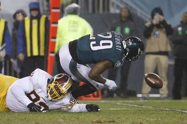 Philadelphia Eagles' DeMarco Murray chases after a fumble against Washington Redskins' Chris Baker (92) in the second half of an NFL football game, Saturday, Dec. 26, 2015, in Philadelphia.  (AP Photo/Matt Rourke)