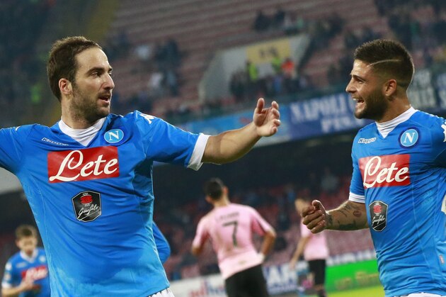 Napoli's Argentinian-French forward Gonzalo Higuain celebrates with teammate Napoli's Italian forward Lorenzo Insigne after scoring during the Italian Serie A football match SSC Napoli vs US Palermo on October 28, 2015 at the San Paolo stadium in Naples. AFP PHOTO / CARLO HERMANN        (Photo credit should read CARLO HERMANN/AFP/Getty Images)