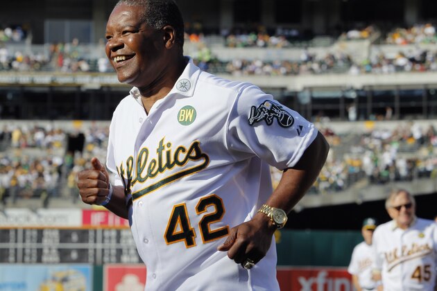 OAKLAND, CA - JULY 19:  Dave Henderson #42 of the 1989 Oakland A's joins his teammates as they celebrate their World Series championship 25 years ago against the San Francisco Giants before a game at O.co Coliseum on July 19, 2014 in Oakland, California.  (Photo by Brian Bahr/Getty Images)