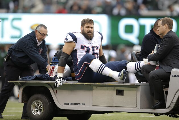 New England Patriots' Sebastian Vollmer (76) is carted off the field during the first half of an NFL football game against the New York Jets Sunday, Dec. 27, 2015, in East Rutherford, N.J. (AP Photo/Kathy Willens)