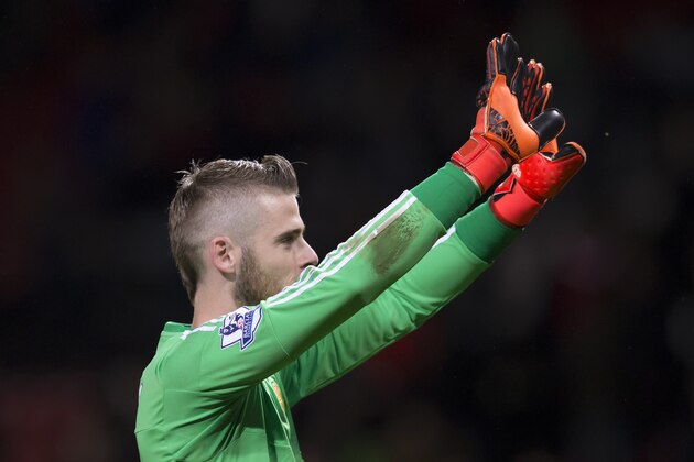 Manchester United's goalkeeper David De Gea waves to the crowd after the English Premier League soccer match between Manchester United and West Bromwich Albion at Old Trafford Stadium, Manchester, England, Saturday, Nov. 7, 2015. (AP Photo/Jon Super)