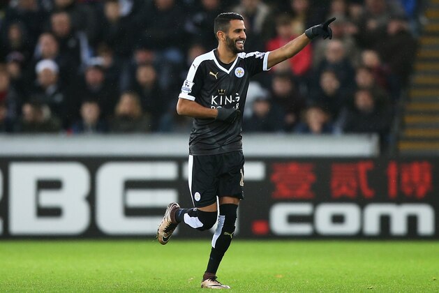SWANSEA, WALES - DECEMBER 05: Riyad Mahrez of Leicester City celebrates scoring his team's first goal during the Barclays Premier League match between Swansea City and Leicester City at Liberty Stadium on December 5, 2015 in Swansea, Wales.  (Photo by Ben Hoskins/Getty Images)