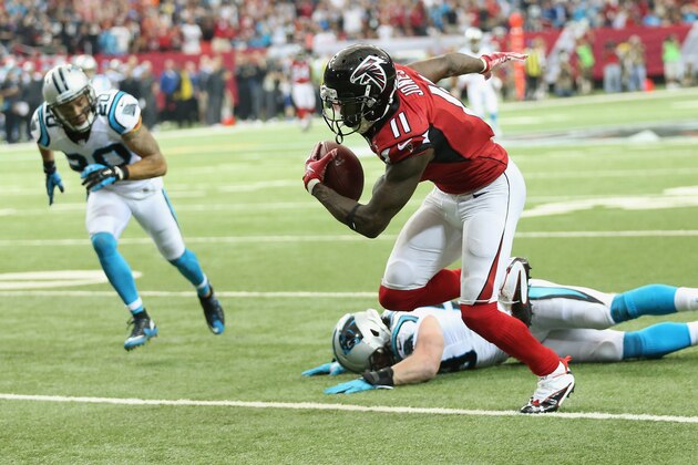 Atlanta Falcons wide receiver Julio Jones (11) moves the ball after making a catch against the Carolina Panthers during the second half of an NFL football game, Sunday, Dec. 27, 2015, in Atlanta. Jones scored a touchdown on the play. (AP Photo/John Bazemore)