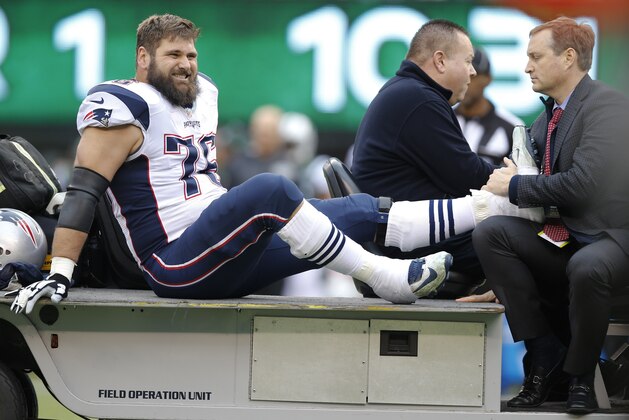 New England Patriots' Sebastian Vollmer (76) is carted off the field during the first half of an NFL football game against the New York Jets, Sunday, Dec. 27, 2015, in East Rutherford, N.J. (AP Photo/Kathy Willens)
