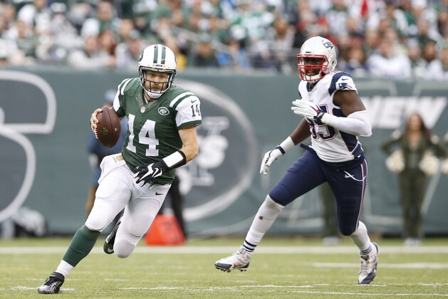 New York Jets quarterback Ryan Fitzpatrick (14) runs away from New England Patriots' Chandler Jones (95) during the first half of an NFL football game Sunday, Dec. 27, 2015, in East Rutherford, N.J. (AP Photo/Kathy Willens)