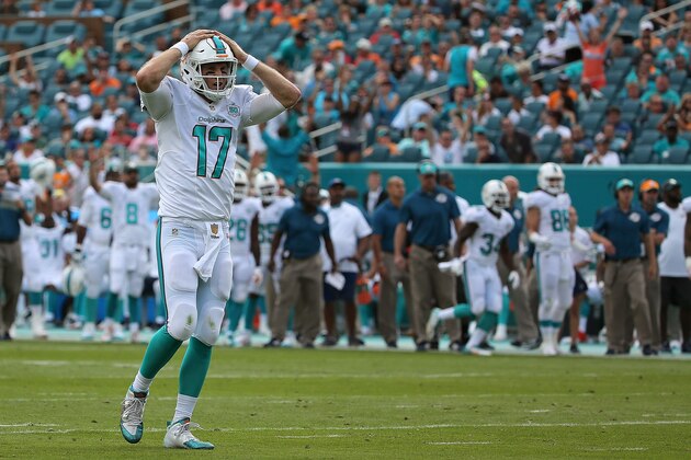 MIAMI GARDENS, FL - DECEMBER 27:  Ryan Tannehill #17 of the Miami Dolphins reacts to a play during a game against the Indianapolis Colts at Sun Life Stadium on December 27, 2015 in Miami Gardens, Florida.  (Photo by Mike Ehrmann/Getty Images)