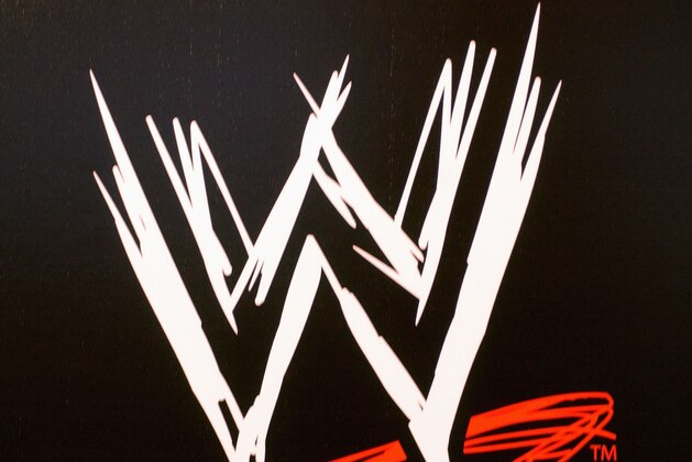 NEW YORK - MARCH 18:  The World Wrestling Entertainment logo hangs on a wall at a media conference announcing the all-star lineup of WWE WrestleMania XIX at ESPN Zone in Times Square March 18, 2003 in New York City.  (Photo by Mark Mainz/Getty Images)