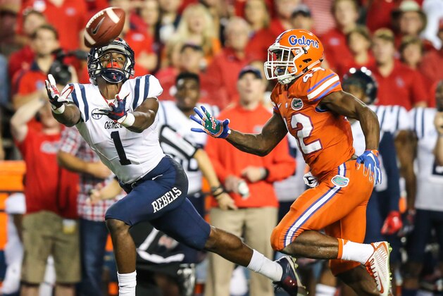 Mississippi wide receiver Laquon Treadwell (1) drops a pass in front of Florida defensive back Keanu Neal (42) during the second half of an NCAA college football game Saturday, Oct. 3, 2015, in Gainesville, Fla. Florida won 38-10. (AP Photo/Gary McCullough)