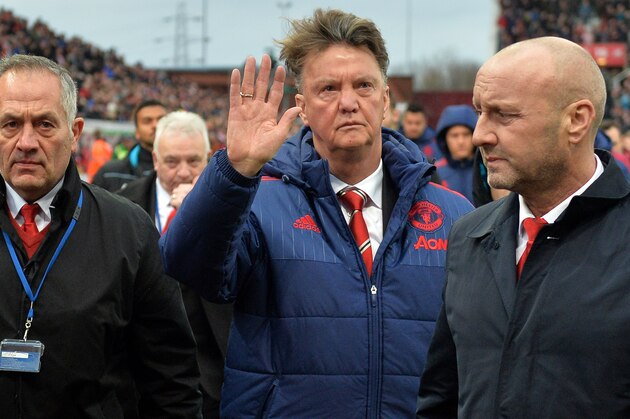 Manchester United's Dutch manager Louis van Gaal (C) waves as he leaves after the English Premier League football match between Stoke City and Manchester United at the Britannia Stadium in Stoke-on-Trent, central England on December 26, 2015. Stoke won the game 2-0. AFP PHOTO / PAUL ELLIS

RESTRICTED TO EDITORIAL USE. No use with unauthorized audio, video, data, fixture lists, club/league logos or 'live' services. Online in-match use limited to 75 images, no video emulation. No use in betting, games or single club/league/player publications.. / AFP / PAUL ELLIS        (Photo credit should read PAUL ELLIS/AFP/Getty Images)