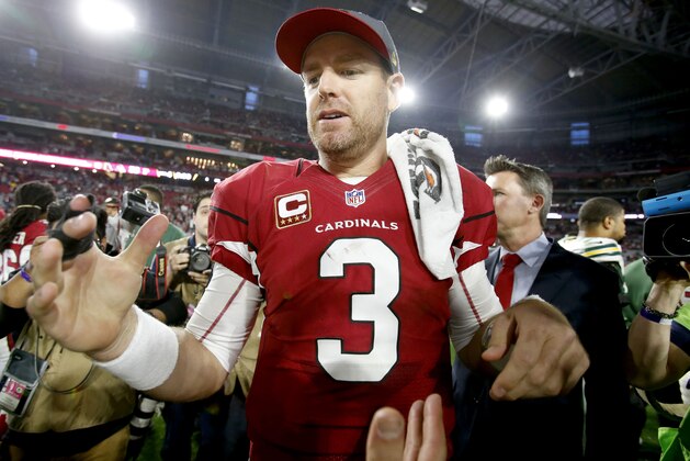 Arizona Cardinals quarterback Carson Palmer (3) stands at mid field after an NFL football game against the Green Bay Packers, Sunday, Dec. 27, 2015, in Glendale, Ariz. The Cardinals won 38-8. (AP Photo/Rick Scuteri)