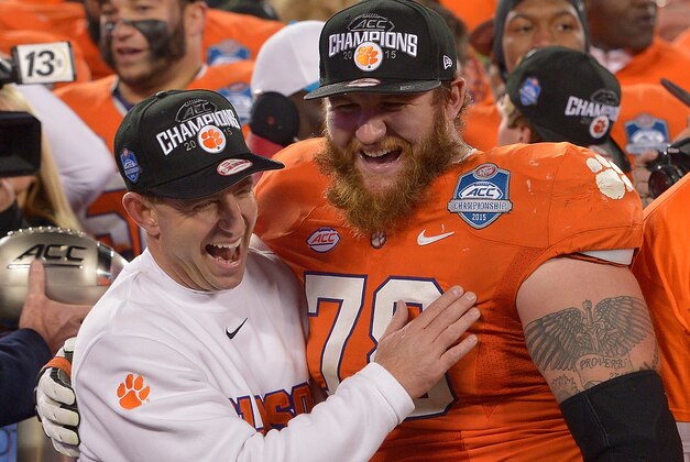 CHARLOTTE, NC - DECEMBER 05:  Eric Mac Lain #78 and head coach Dabo Swinney of the Clemson Tigers  celebrate after a win against the North Carolina Tar Heels during the Atlantic Coast Conference Football Championship at Bank of America Stadium on December 5, 2015 in Charlotte, North Carolina. Clemson won 45-37.  (Photo by Grant Halverson/Getty Images)