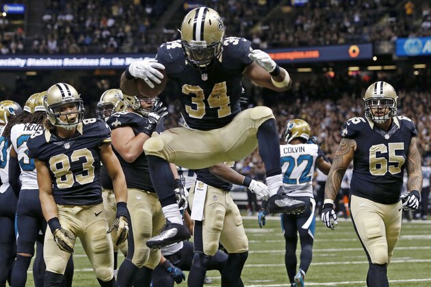 New Orleans Saints running back Tim Hightower (34) celebrates his touchdown in the second half of an NFL football game against the Jacksonville Jaguars in New Orleans, Sunday, Dec. 27, 2015. (AP Photo/Jonathan Bachman)