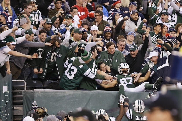New York Jets wide receiver Eric Decker (87) celebrates with fans after catching a pass for a touchdown during the overtime period of an NFL football game against the New England Patriots unday, Dec. 27, 2015, in East Rutherford, N.J. The Jets won 26-20. (AP Photo/Seth Wenig)