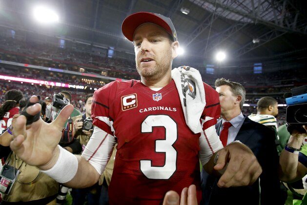 Arizona Cardinals quarterback Carson Palmer (3) stands at mid field after an NFL football game against the Green Bay Packers, Sunday, Dec. 27, 2015, in Glendale, Ariz. The Cardinals won 38-8. (AP Photo/Rick Scuteri)