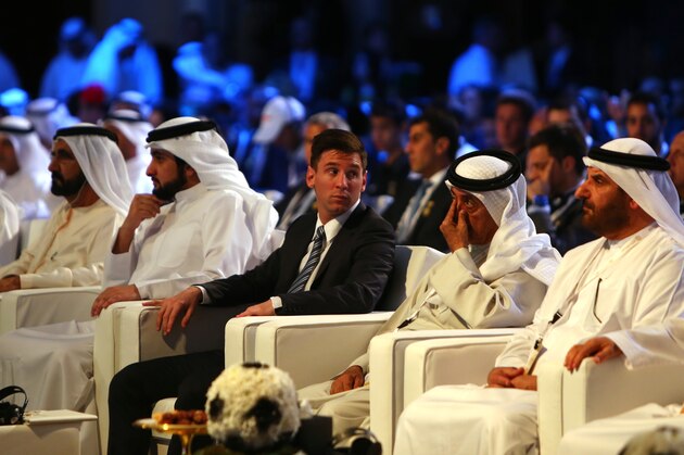 Barcelona football striker Lionel Messi (C) attends the opening session of the 10th edition of the Dubai International Sports Conference in Dubai on December 27, 2015. AFP PHOTO / MARWAN NAAMANI / AFP / MARWAN NAAMANI        (Photo credit should read MARWAN NAAMANI/AFP/Getty Images)