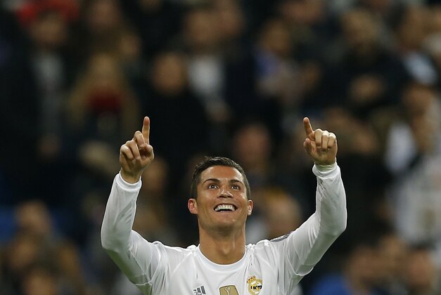 Real Madrid’s Cristiano Ronaldo celebrates scoring his side's 5th goal during a Champions League group A soccer match between Real Madrid and Malmo at the Santiago Bernabeu stadium in Madrid, Tuesday, Dec. 8, 2015. (AP Photo/Francisco Seco)