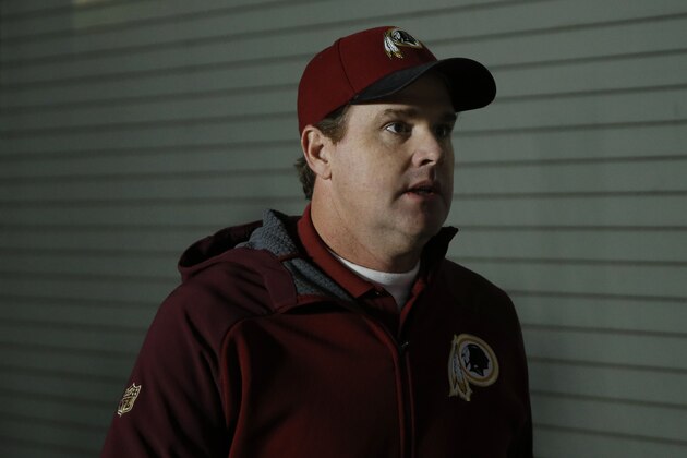 Washington Redskins head coach Jay Gruden walks to the field before an NFL football game against the Philadelphia Eagles, Saturday, Dec. 26, 2015, in Philadelphia.  (AP Photo/Matt Rourke)