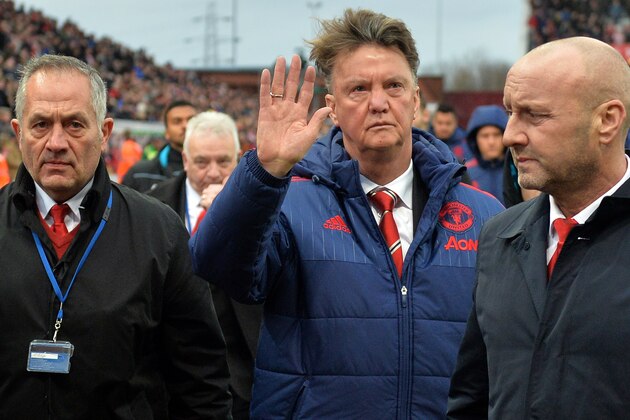 Manchester United's Dutch manager Louis van Gaal (C) waves as he leaves after the English Premier League football match between Stoke City and Manchester United at the Britannia Stadium in Stoke-on-Trent, central England on December 26, 2015. Stoke won the game 2-0. AFP PHOTO / PAUL ELLIS

RESTRICTED TO EDITORIAL USE. No use with unauthorized audio, video, data, fixture lists, club/league logos or 'live' services. Online in-match use limited to 75 images, no video emulation. No use in betting, games or single club/league/player publications.. / AFP / PAUL ELLIS        (Photo credit should read PAUL ELLIS/AFP/Getty Images)