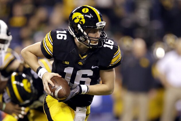 Iowa quarterback C.J. Beathard (16) looks to hand the ball off during the first half of the Big Ten Conference championship NCAA college football game against Michigan State Saturday, Dec. 5, 2015, in Indianapolis. (AP Photo/Michael Conroy)