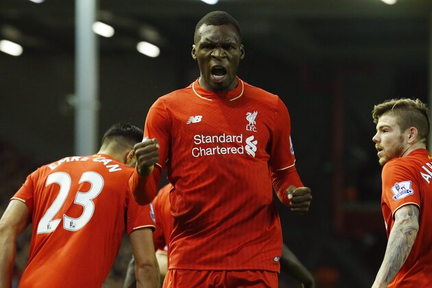 Liverpool's Zaire-born Belgian striker Christian Benteke (C) celebrates scoring the opening goal of during the English Premier League football match between Liverpool and Leicester City at the Anfield stadium in Liverpool, north-west England on December 26, 2015.  AFP PHOTO / LINDSEY PARNABY

RESTRICTED TO EDITORIAL USE. No use with unauthorized audio, video, data, fixture lists, club/league logos or 'live' services. Online in-match use limited to 75 images, no video emulation. No use in betting, games or single club/league/player publications. / AFP / LINDSEY PARNABY        (Photo credit should read LINDSEY PARNABY/AFP/Getty Images)