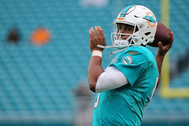 MIAMI GARDENS, FL - AUGUST 29:  Josh Freeman #5 of the Miami Dolphins warms up during a preseason game against the Atlanta Falcons at Sun Life Stadium on August 29, 2015 in Miami Gardens, Florida.  (Photo by Mike Ehrmann/Getty Images)